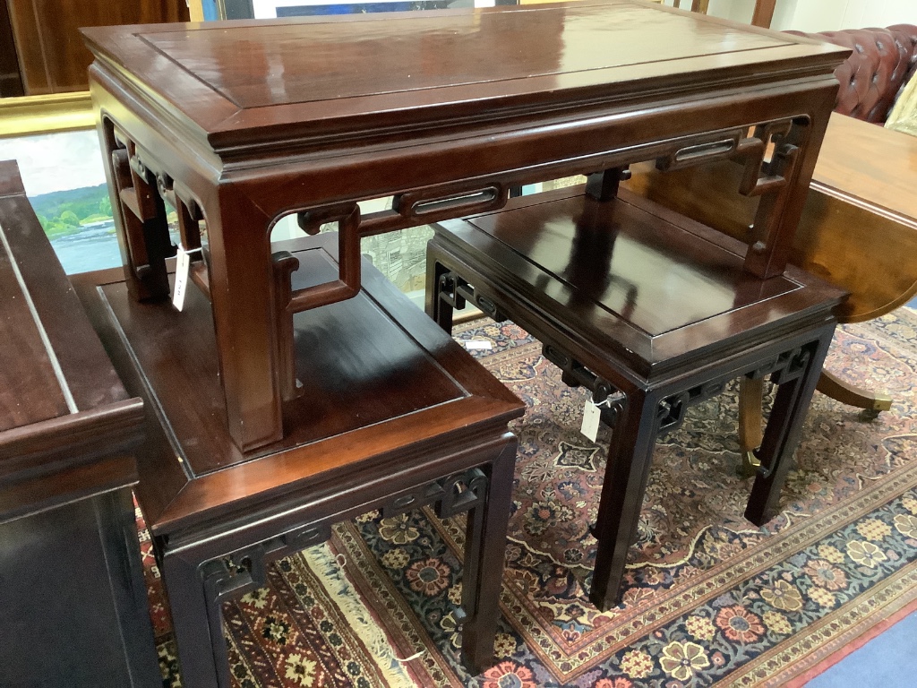 A 20th century Chinese rectangular hardwood low coffee table and a pair of similar lamp tables, largest width 106cm depth 51cm height 40cm